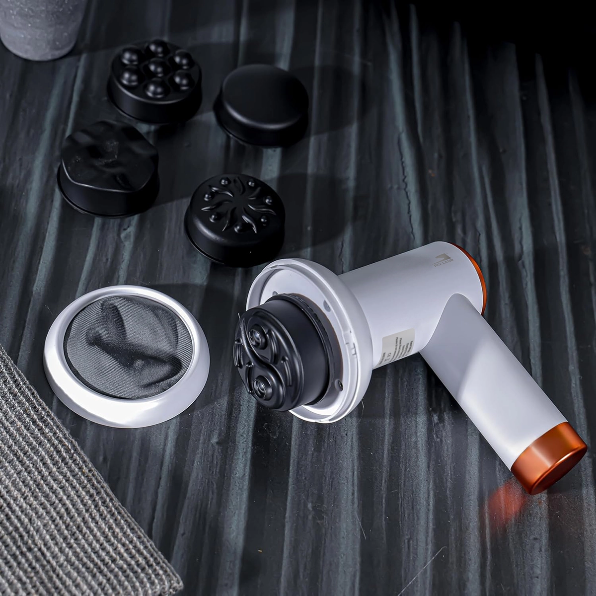 SKY LAND EM-4139 cordless massage gun with removable massage head and interchangeable attachments, showcasing quick head replacement for customized deep tissue massage and muscle recovery.